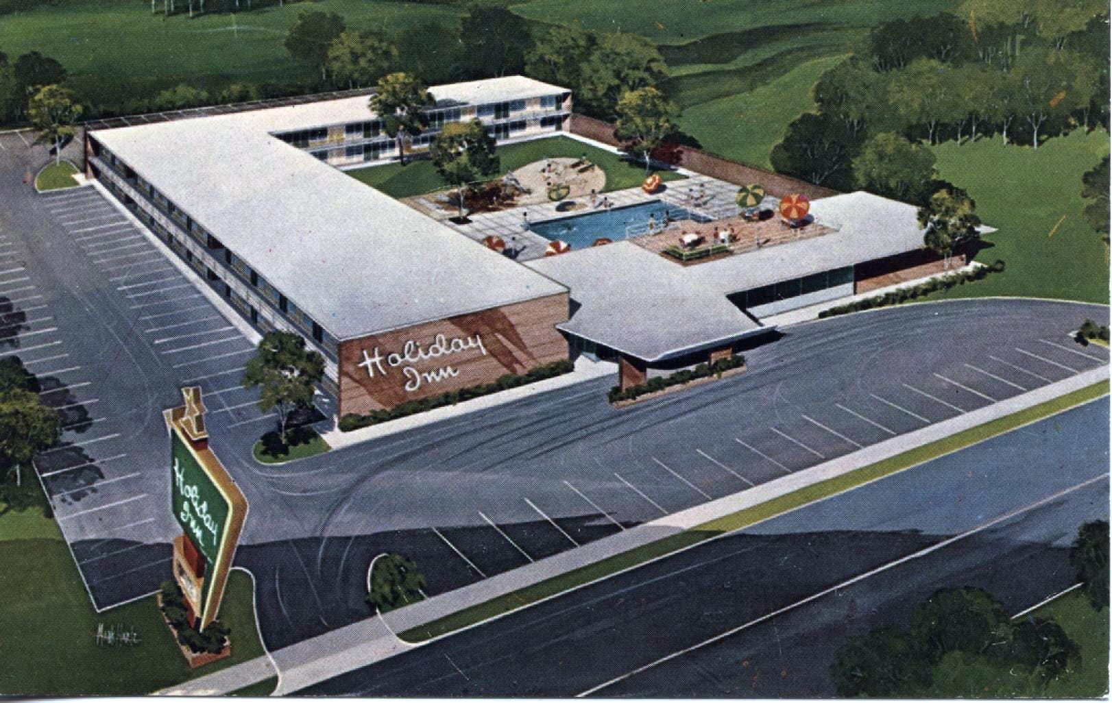 Postcard image of a Holiday Inn with a pool in the courtyard.