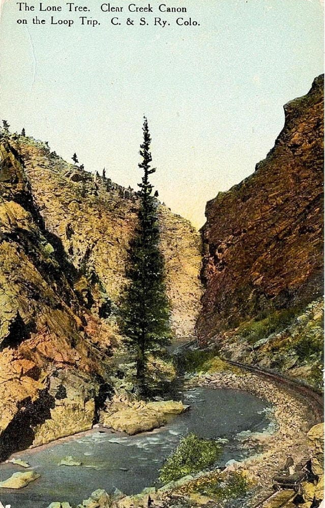 "The Lone Tree" shows a tall pine at the bottom of a canyon with a creek and narrow gauge tracks nearby.