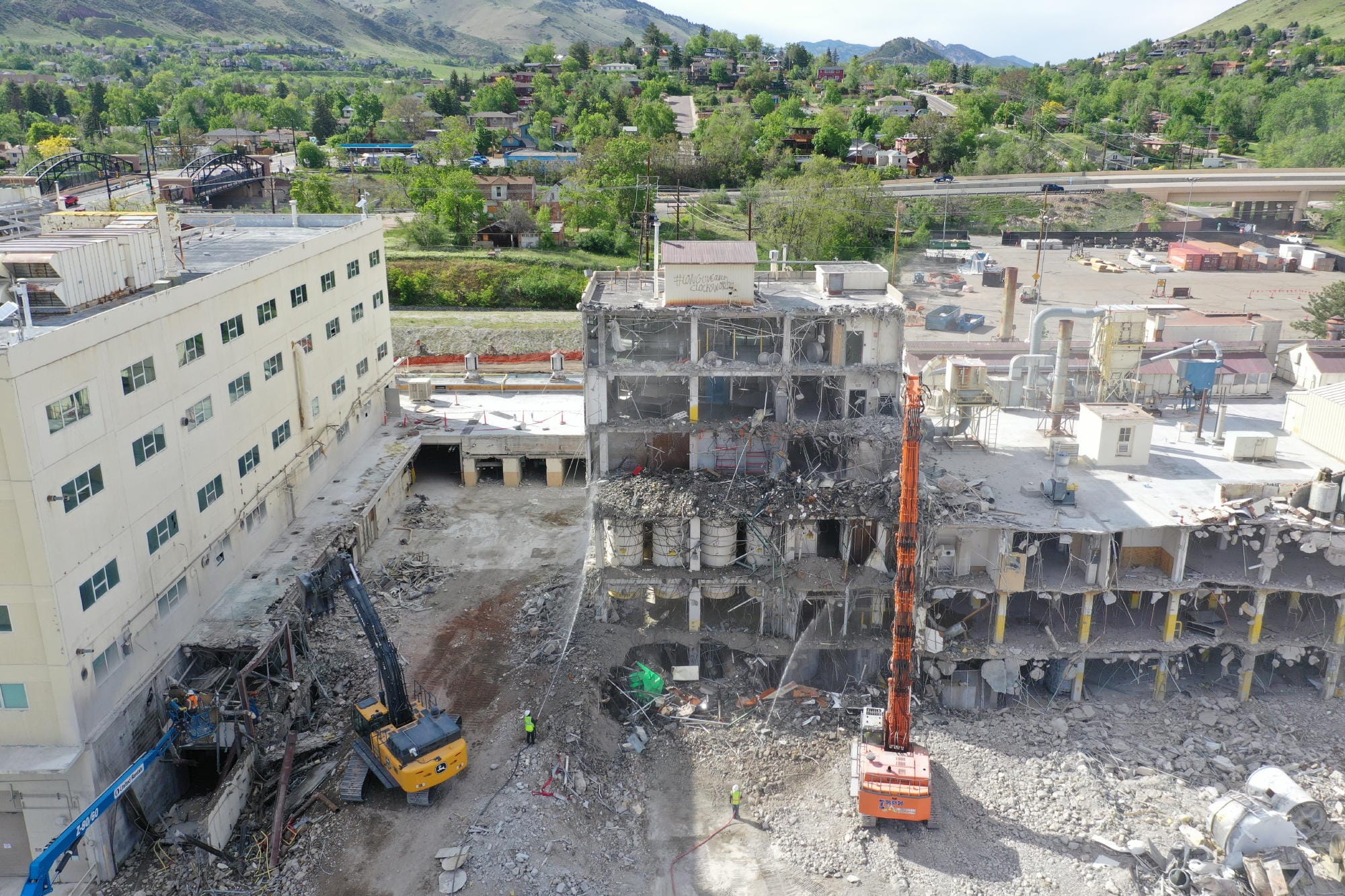 Cranes pulling down industrial buildings