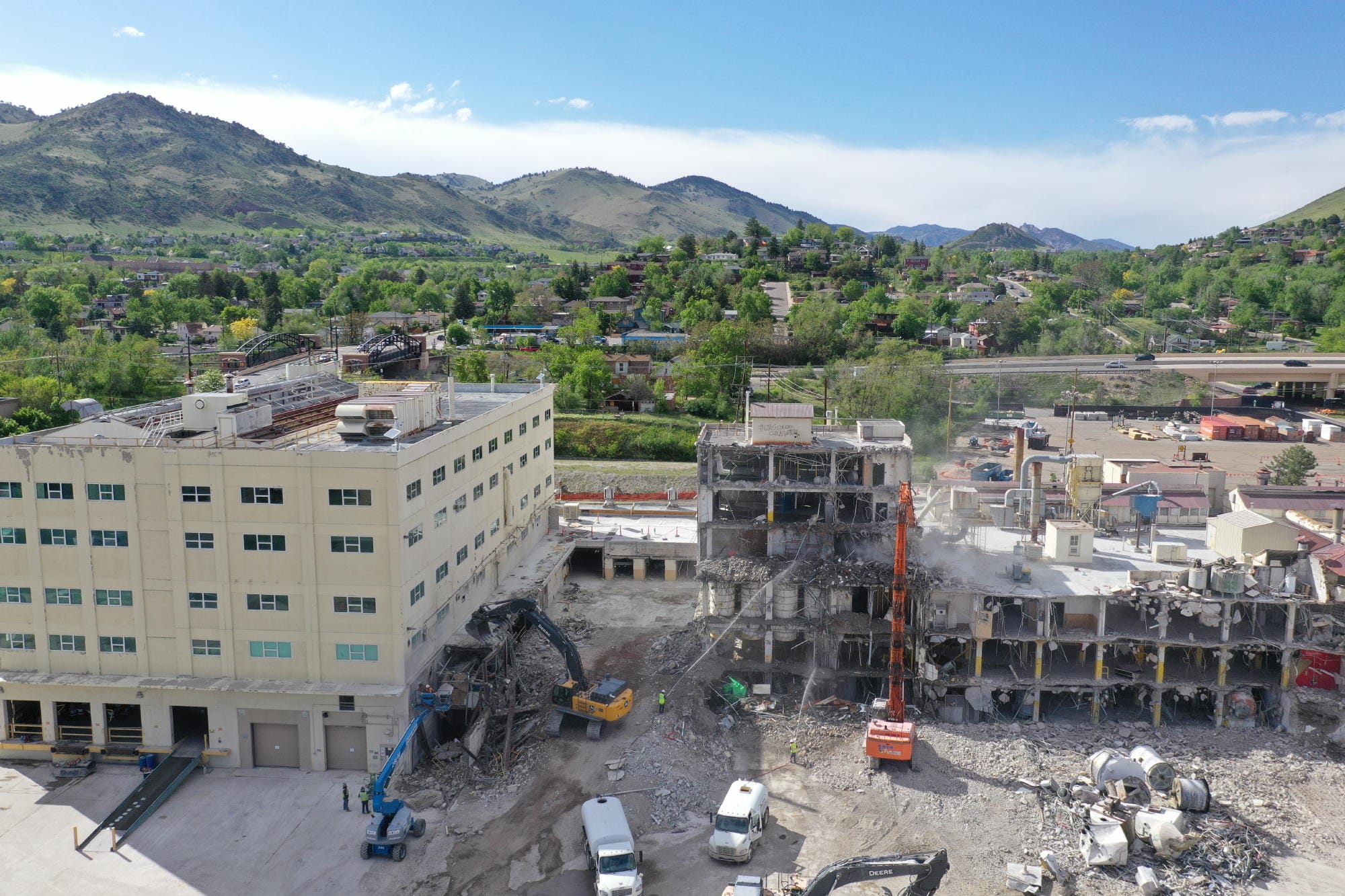 Cranes pulling down industrial buildings