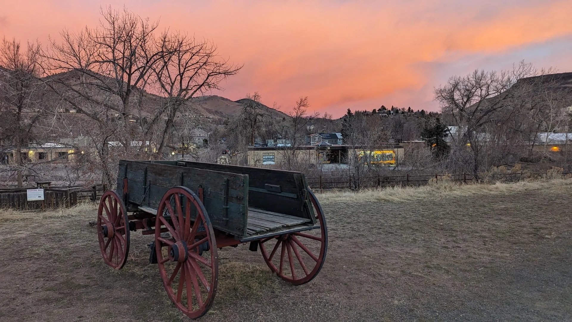 a wagon in a field at dawn