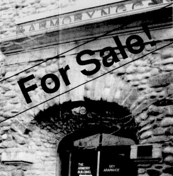 Black and white newspaper image of the Armory building with "For Sale" printed across the photo.
