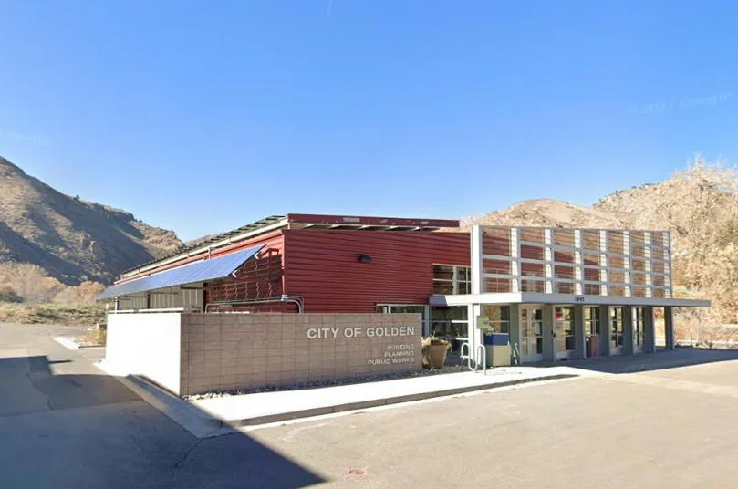 photo of a one story building with solar panels