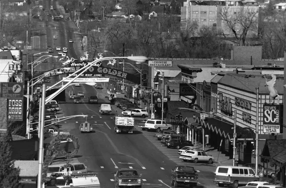 Washington Avenue with a horse perched on the Western Wear store sign, vacant Hested's department store, Foss Drug.