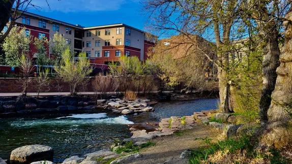 Clear Creek through downtwon Golden - greenery just beginning to emerge along the sides.