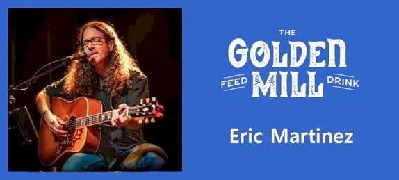 Eric Martinez at the Golden Mill - man with long curly hair and glasses seated and playing guitar