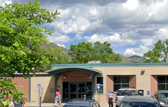 Golden Library with people walking in and out