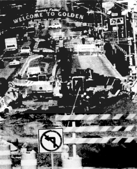 Washington Avenue torn up for construction with barricades and heavy equipment.