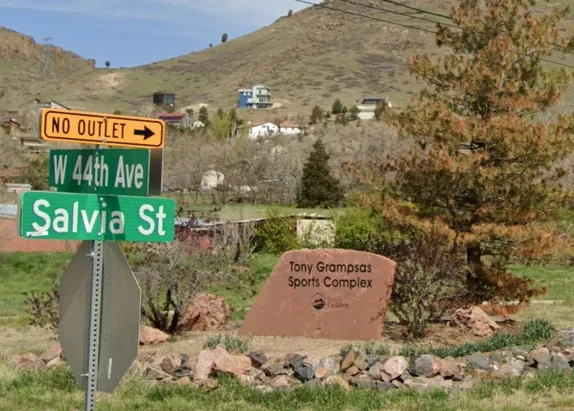 Street signs for W. 44th Ave & Salvia St, stone marker for Tony Grampsas Sports Compl