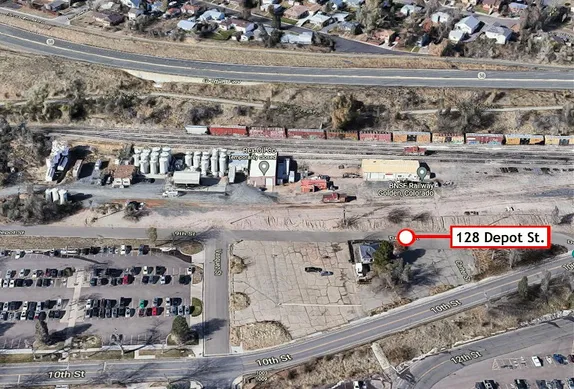 satellite view of the Goosetown neighborhood with a marker at 128 Depot Street, near the railyards